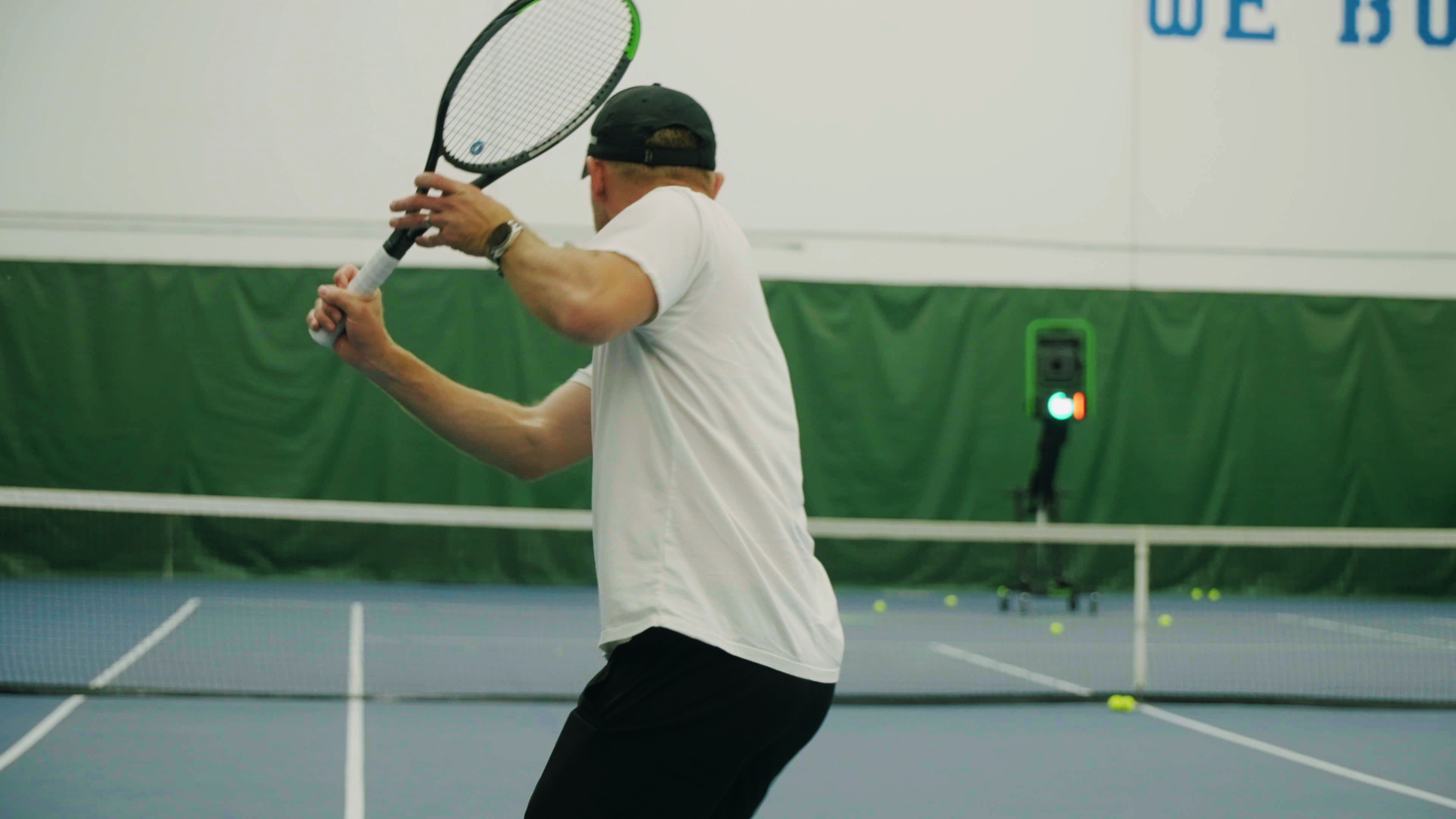 Volley tennis trainer on court